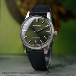 MB1 L07 Olive Green watch black strap with autumn background